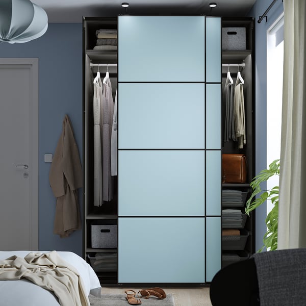 Blue sliding closet with clothes and storage, featuring soft-close mechanism and adjustable feet.