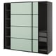 Modern, grey PAX wardrobe with green-tinted sliding doors, featuring a minimalist design and multiple shelves.