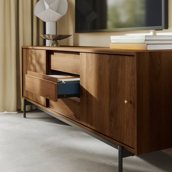 Wooden tv stand with open drawer, blue interior, and gold knobs.