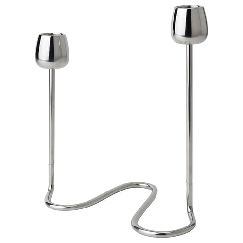 The SILVERPÄRON set includes two stainless steel candlesticks with curved, stem-like bases and rounded cups, reflecting natural flower designs.