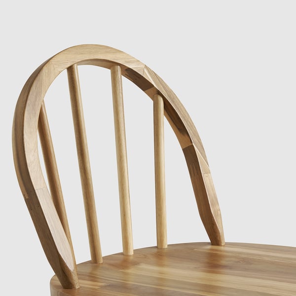 Elegant acacia wooden chair with curved backrest and sturdy design.