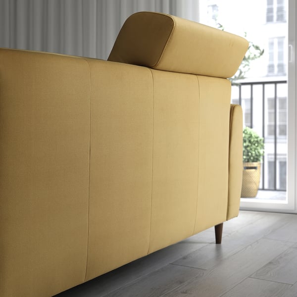 A modern yellow sofa, SLATORP, with adjustable back cushions for extra head comfort. It a high backrest and supportive seat, ideal for relaxing.
