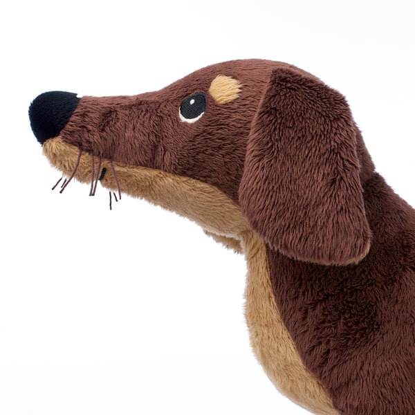 Cuddly dog toy with soft brown fur, realistic details, and a friendly, embroidered face; perfect for childrens play and comfort.