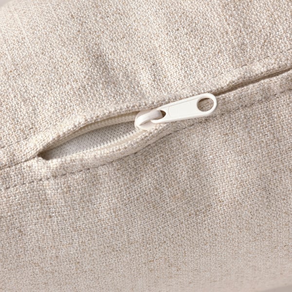 Close-up of beige fabric with white zip, showcasing high-quality, textured material.
