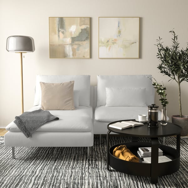 Modern living room with SÖDERHAMN chaise, coffee table, lamp, and paintings.