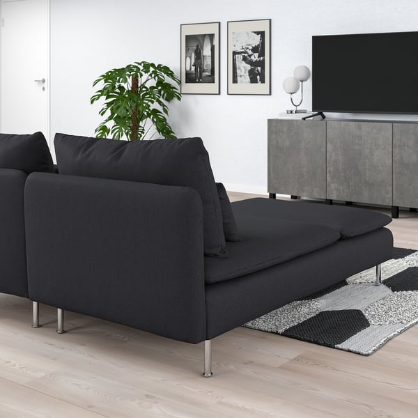 Modern living room with grey SÖDERHAMN sectional sofa, plant, tv, and art.