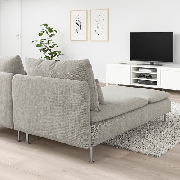 Modern living room with grey SÖDERHAMN sofa and plant, minimalist art.