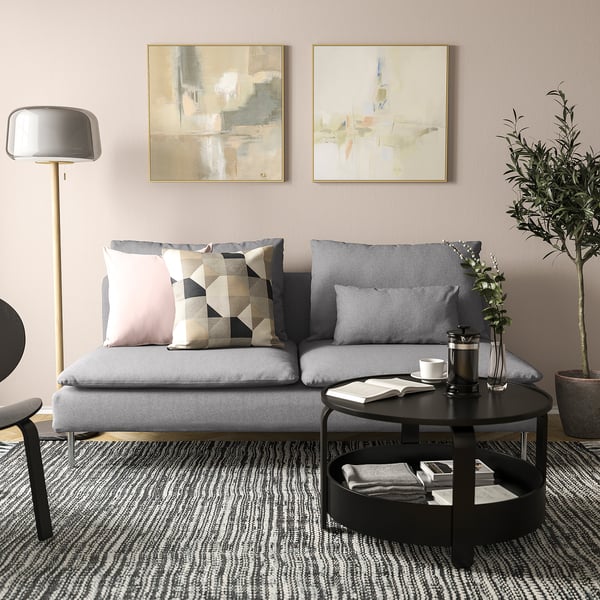Grey SÖDERHAMN sofa with pillows, art, plant, dark rug