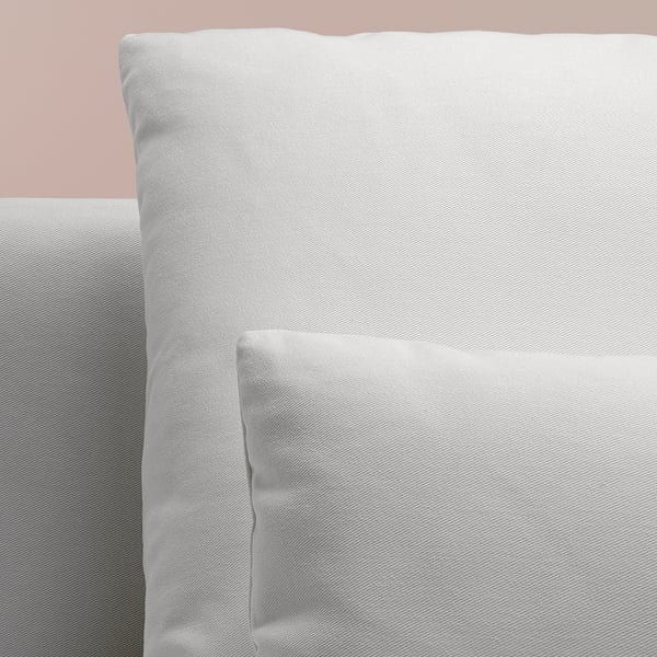 Sofa close-up: clean-lined, soft, inviting, plush cushions, deep seats, designed for comfort.