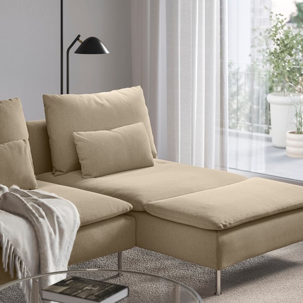 A beige SÖDERHAMN chaise longue by a window, providing a comfortable spot to relax and read.