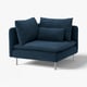 Deep seated navy blue sofa with high metal legs and two large pillows.