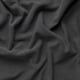 Dark grey textured fabric close-up, woven with intricate pattern, soft yet sturdy feel.