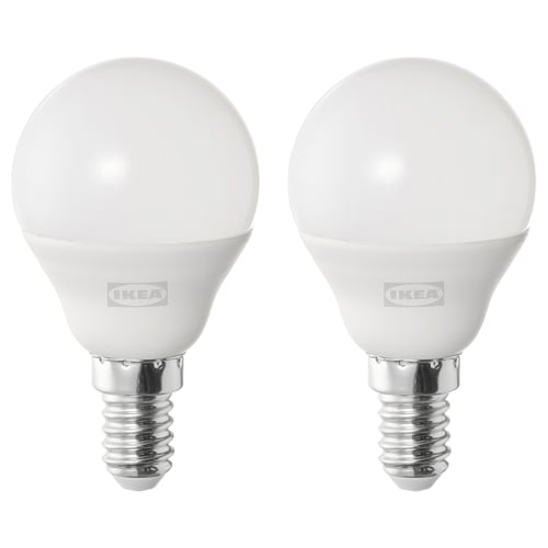 Two white ikea led bulbs, spherical shape, cool-white light, stand on metallic bases.