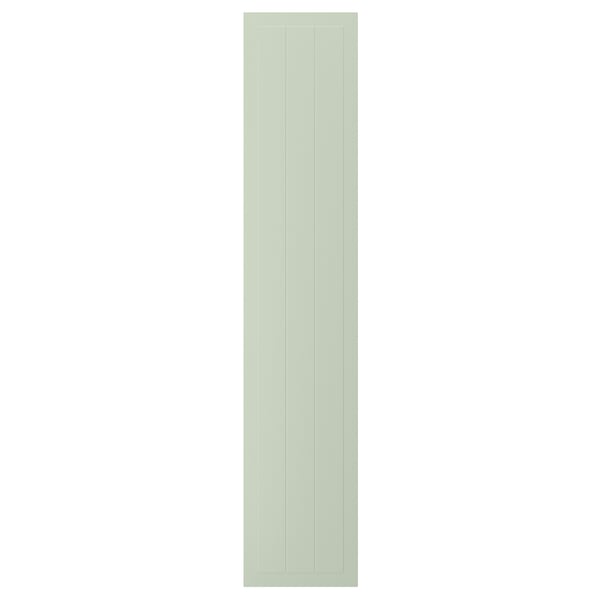 A rectangular, green STENSUND cabinet door. It vertical grooved panels and a smooth, lacquered finish, giving it a crafted look.