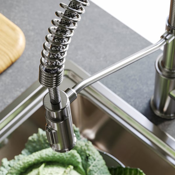 Stainless steel kitchen tap with flexible sprayer.