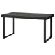 A TARSELE extendable dining table. Its black with a veneer top and metal legs, featuring a 1950s industrial design.