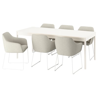 A TONSTAD dining set featuring a white rectangular table and four light grey cushioned chairs with metal frames.