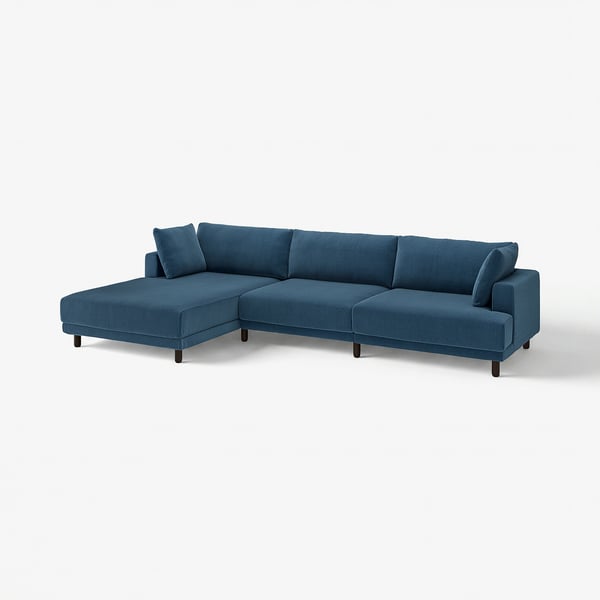 Modern u-shaped blue sofa, cushioned, wooden legs, cosy design.