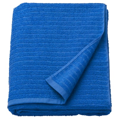 Folded bright blue VÅGSJÖN towel with stripe pattern and terry texture.