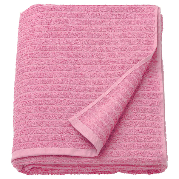Bright pink VÅGSJÖN towel, folded, terry texture.