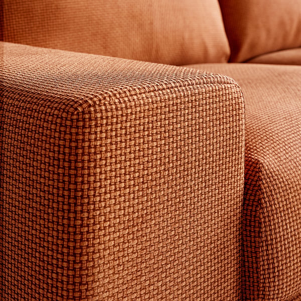 Soft, textured brown sofa with intricate weave, inviting comfort and quality.