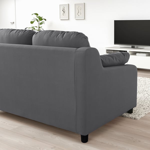 Modern dark grey VINLIDEN sofa, large cushions, fits spacious living room, with tv stand & rug.