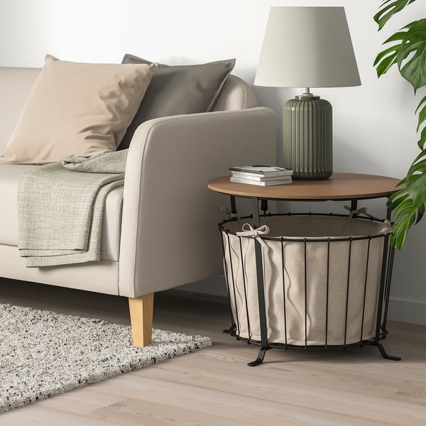 ÄNGESBYN: rustic side table with wooden top, metal base, and storage bag.