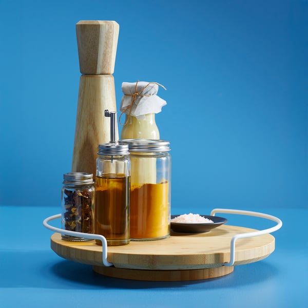 Bamboo turntable with pepper mill, jars, salt bowl.