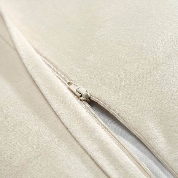 Close-up of cushion cover zip, showing smooth, high-quality fabric and sleek zip detail.