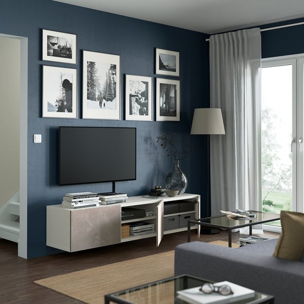 Modern living room with BESTÅ, tv, shelves, drawers, and large windows.