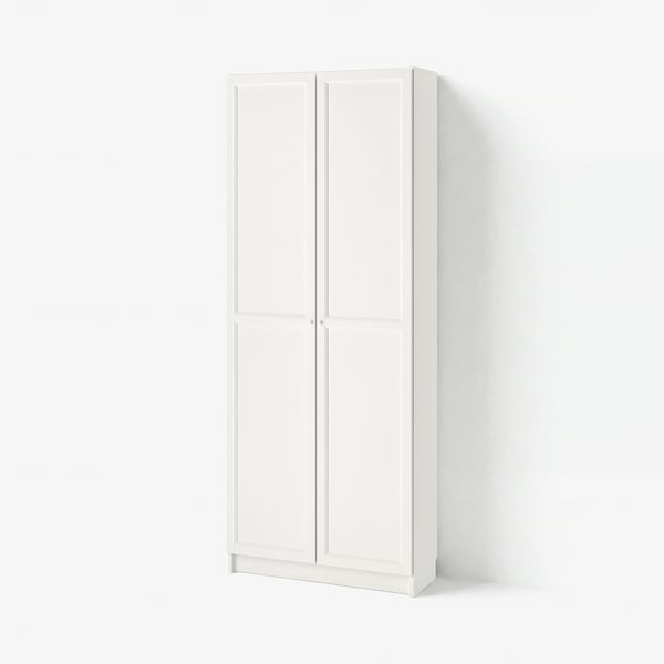 A white BILLY bookcase. It stands tall, rectangular, with four panel doors. The clean design offers hidden storage.