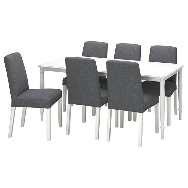 A modern dining set with a white square table and six grey upholstered chairs.