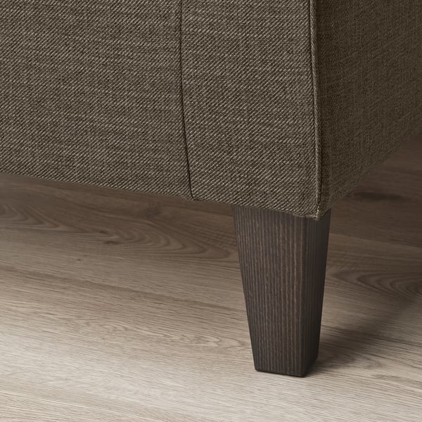 Close-up of sofa leg, showing quality hardwood and finish.
