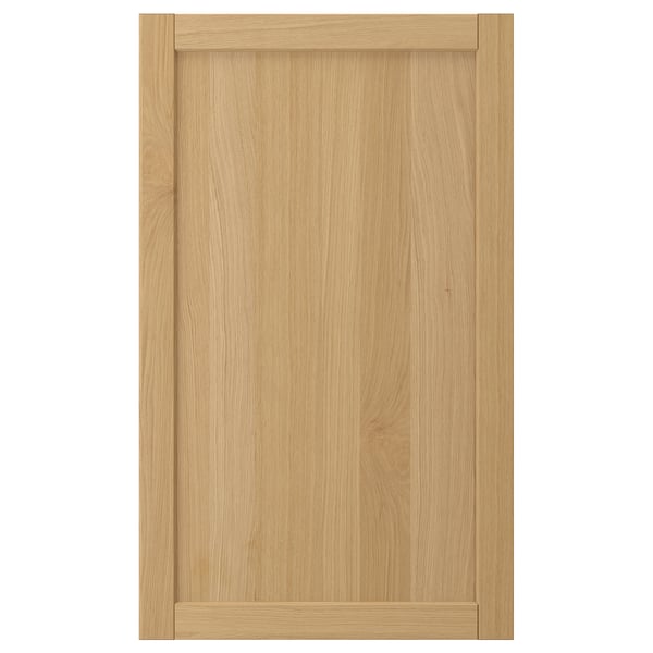 Natural wood cabinet door with bevelled edges.