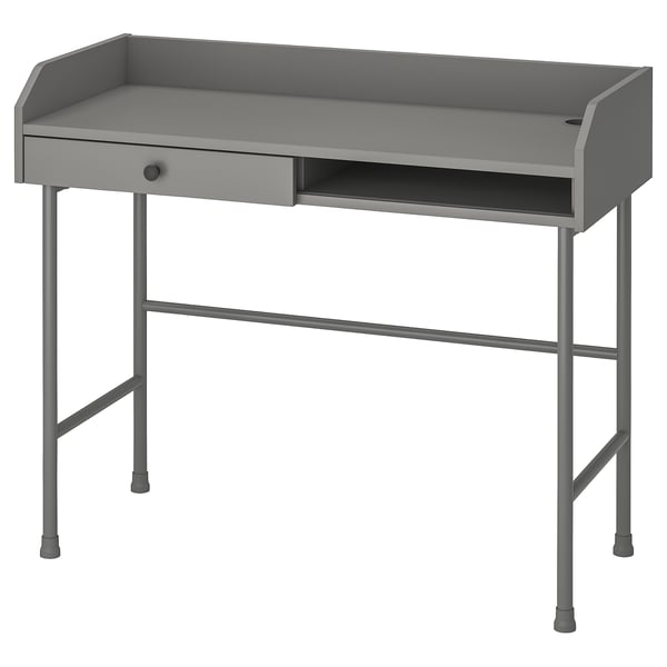 A grey HAUGA desk with a modern design. Made of metal and wood, it a tabletop, drawer, and open compartment, offering workspace and storage.