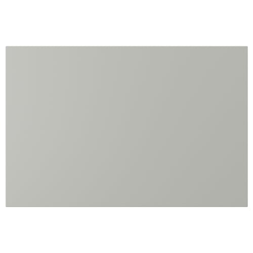 A rectangular, light grey HAVSTORP kitchen cabinet front. The smooth, lacquered surface ensures easy cleaning and a modern look.