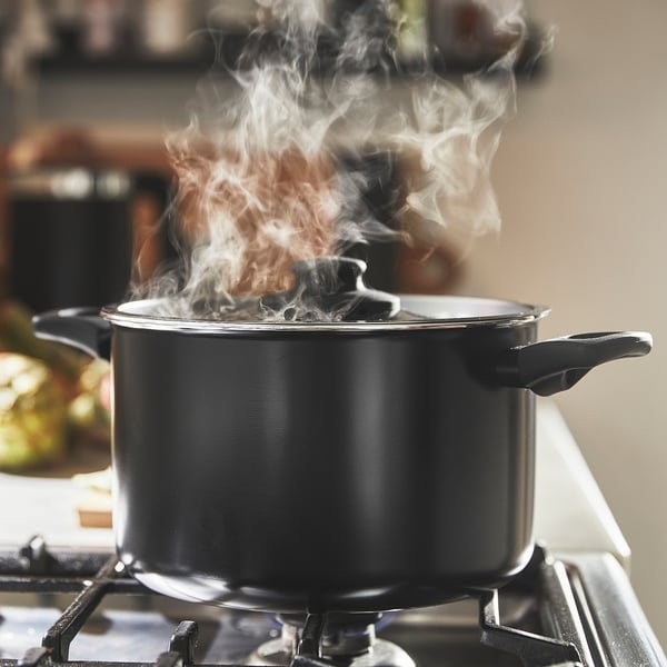 Pan on stove steaming, non-stick.