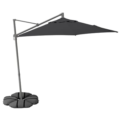 Black cantilever umbrella with grey stand, polyester canopy, adjustable tilt, aluminium pole, and sandbag base.