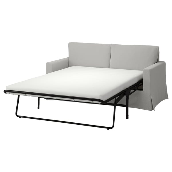 Grey HYLTARP sofa bed, modern and comfy, with clean lines and reversible cushions.