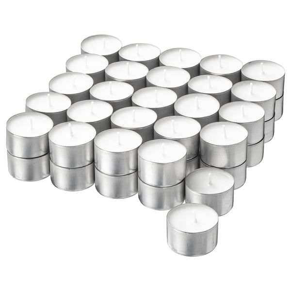 Collection of white JUBLA candles in silver aluminium holders, arranged neatly in rows, cylindrical shape.