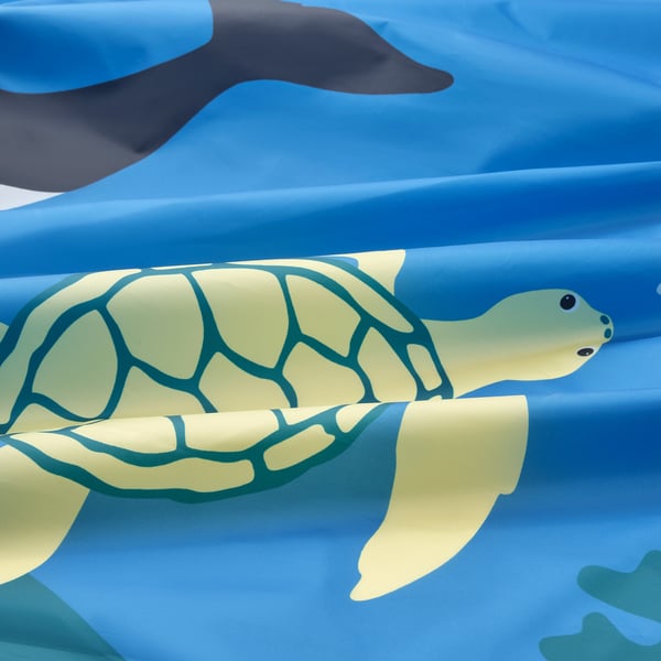 Vibrant sea turtle bed tent, pristine condition, floating smoothly.