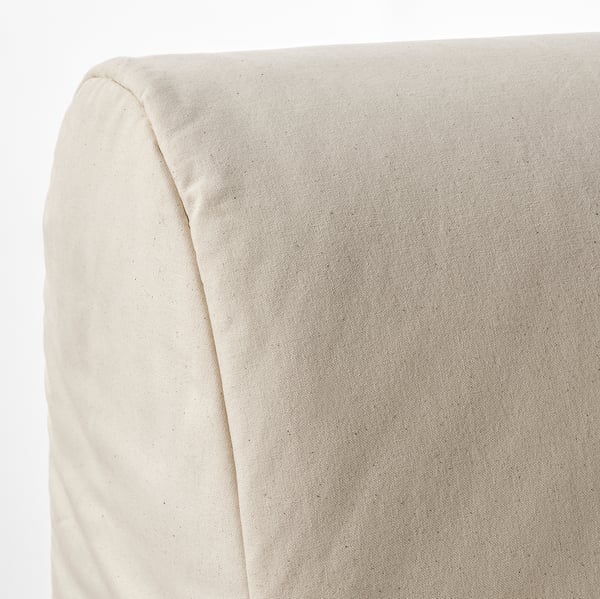 Closeup of lycksele sofa corner, showcasing smooth, beige fabric and neat stitching.