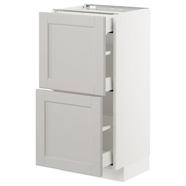 A white METOD kitchen cabinet with grey lerhyttan fronts, featuring two drawers and two doors, a classic traditional design.
