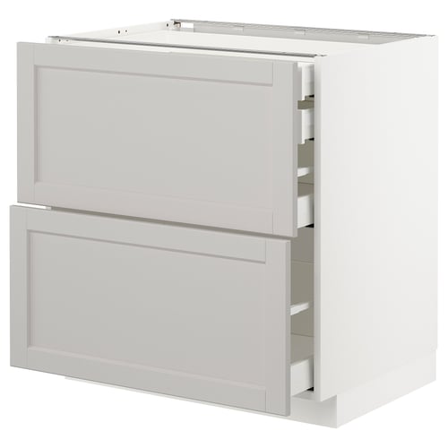 A white METOD kitchen cabinet with two shallow drawers and one larger drawer, featuring classic grey panels and bevelled edges.