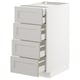 White METOD kitchen unit with four grey drawers, bevelled edges.
