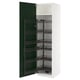 Green pull-out shelves in white cabinet.
