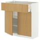 METOD kitchen cabinet with oak doors, partially open.