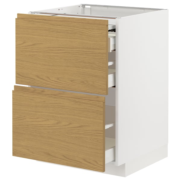 A white METOD kitchen cabinet with wooden drawers. It has a modern, minimalist design with integrated handles and oak-colored drawer fronts.