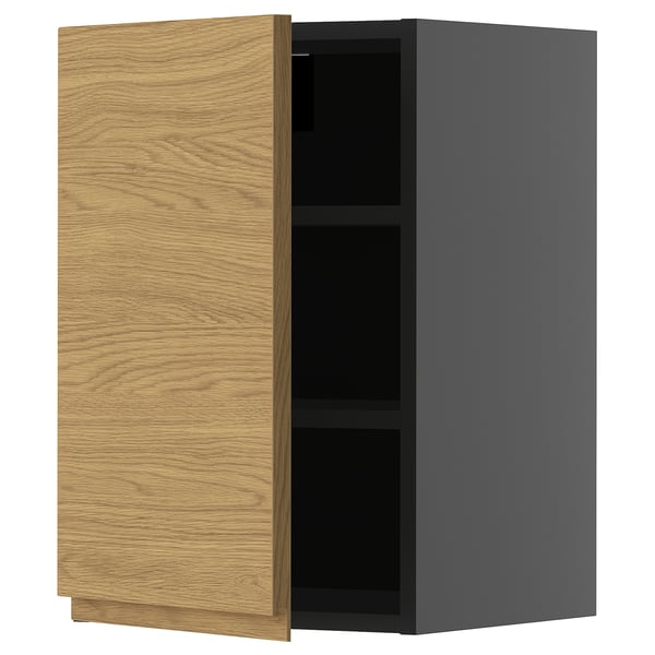 A modern kitchen cabinet named METOD. It a light wooden door with a minimalist design on one side and sleek grey exterior.