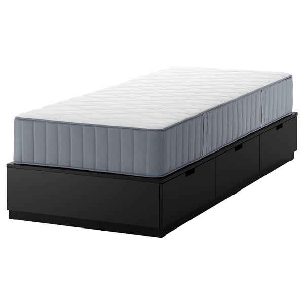 NORDLI black bed frame with drawers and grey mattress.
